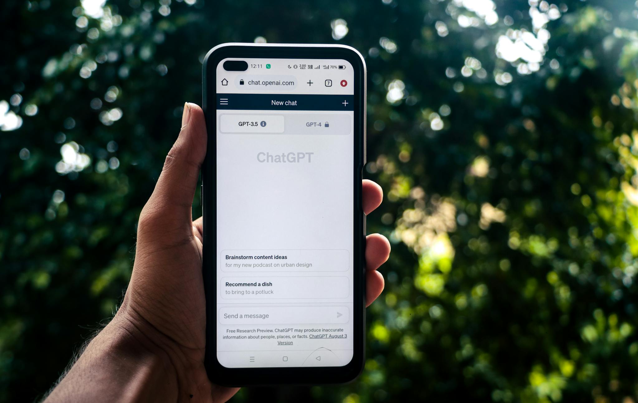 Webpage of ChatGPT, a prototype AI chatbot, is seen on the website of OpenAI, on a smartphone. Examples, capabilities, and limitations are shown.